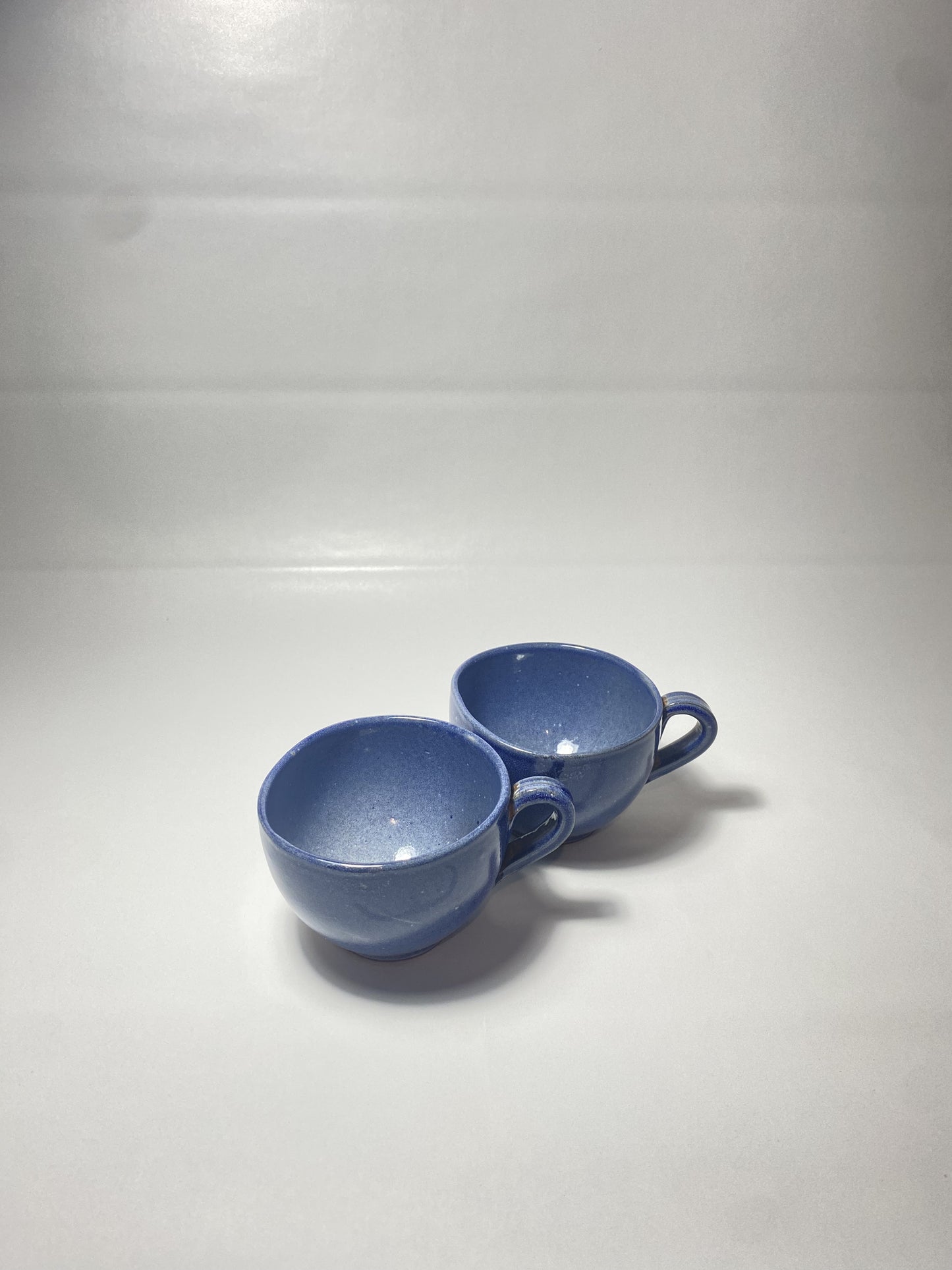 Two small cups of tea set of 2